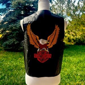 Size medium Harley vest slightly worn no tags leather needs cleaned